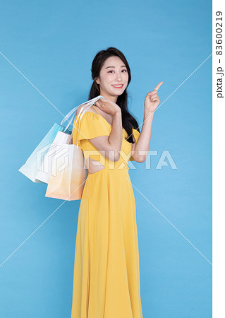 shopping event concept, beautiful Korean Asian woman with shopping bag shopping event concept, beautiful Korean Asian woman with shopping bag 83600219