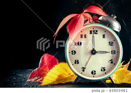 Daylight Saving Time concept, fall back in autumn, with a place for text Daylight Saving Time concept, fall back in autumn, with a place for text 83603461