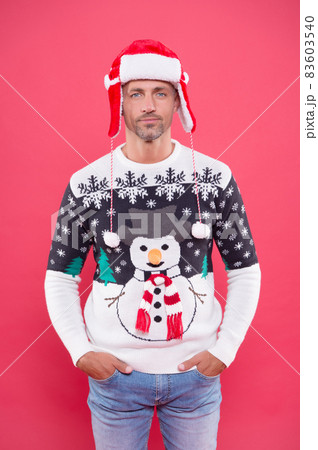 man wearing funny knitted sweater and hat for celebrating christmas party, merry christmas man wearing funny knitted sweater and hat for celebrating christmas party, merry christmas 83603540