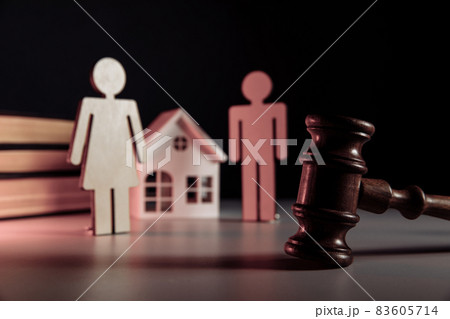 Wooden model of couple, gavel and house on a table Wooden model of couple, gavel and house on a table 83605714