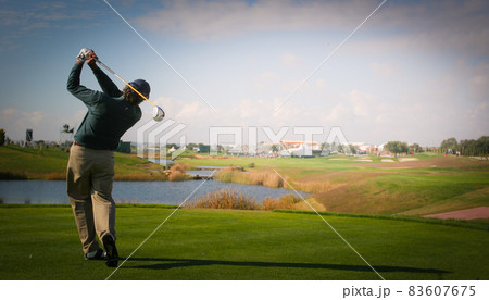 man golfer on a golf course man golfer on a golf course 83607675