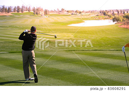 man golfer on a golf course 83608291