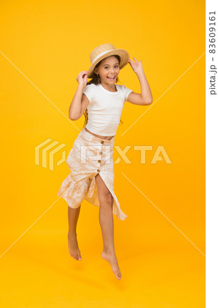 Cheerful small girl summer outfit jumping, fly in air concept 83609161
