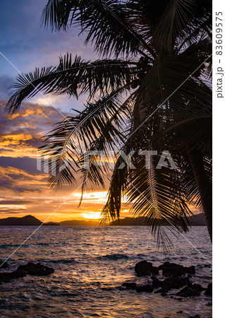 Beautiful sunset over koh Mak tropical island and its beach, near koh Chang, Trat, Thailand Beautiful sunset over koh Mak tropical island and its beach, near koh Chang, Trat, Thailand 83609575