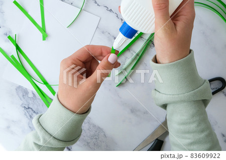 Gift idea, decor Spring, happy Patrick Day. Step by step. Diy St. Patricks Day greeting card made of Quilling and paper clovers on white background. Gift idea, decor Spring, happy Patrick Day. Step by step. Diy St. Patricks Day greeting card made of Quilling and paper clovers on white background. 83609922