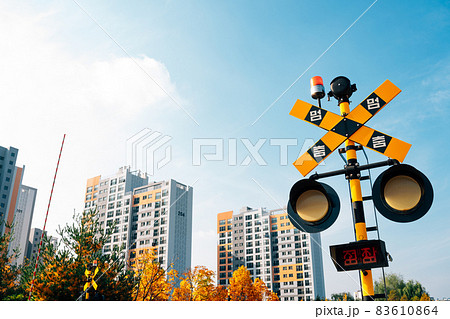 Hangdong Railroad crossing signal railroad barrier at autumn in Seoul, Korea 83610864