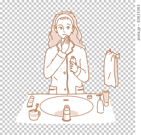 A woman doing skin care in her pajamas A woman doing skin care in her pajamas 83615363