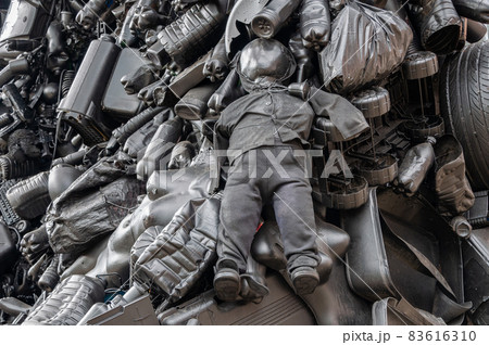 Man is drowning in mountains of plastic trash. An ecological problem. Plastic waste. Disposal of plastic packaging Man is drowning in mountains of plastic trash. An ecological problem. Plastic waste. Disposal of plastic packaging 83616310