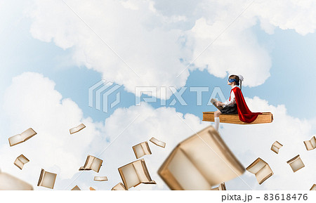 Girl power concept with cute kid guardian against cloudscape background 83618476