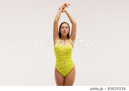 Slim woman in underwear standing in studio Slim woman in underwear standing in studio 83620336