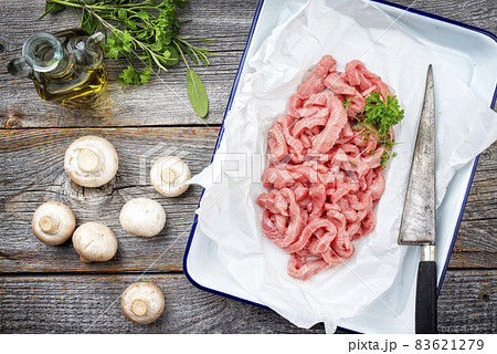 Raw veal strips for traditional Swiss zurcher geschnetzeltes with herbs 83621279