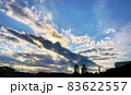 青空と雲と太陽光線と遠景のシルエット 83622557