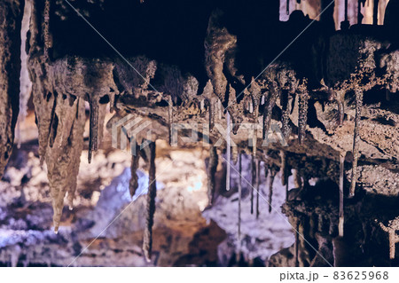 Cave formations of stalactites on ceiling Cave formations of stalactites on ceiling 83625968
