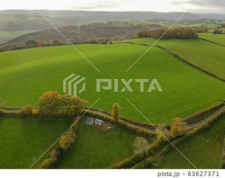 Aerial view of green rural landscape in mid Wales, the central region of Wales Aerial view of green rural landscape in mid Wales, the central region of Wales 83627371