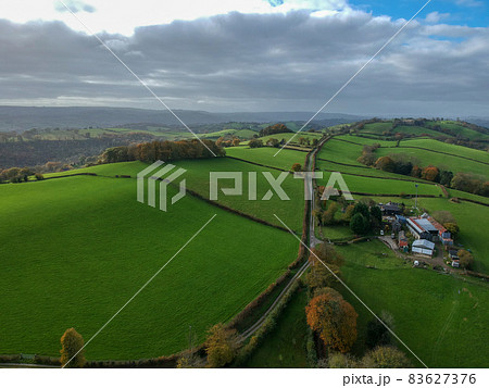 Aerial view of green rural landscape in mid Wales, the central region of Wales 83627376
