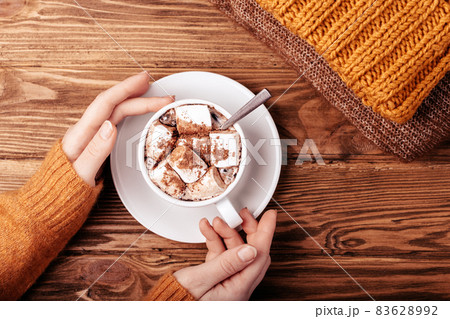 Female hands with cup of cacao flat lay 83628992