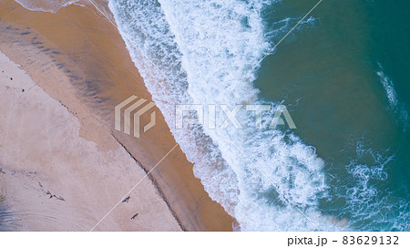 Aerial view sandy beach and waves Beautiful tropical sea in the morning summer season image by Aerial view drone shot, high angle view Top down 83629132