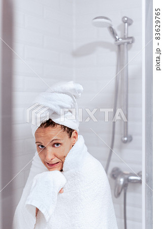 Woman comes out of the shower with very cold 83629765