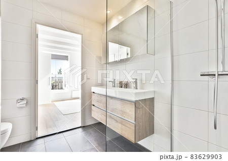 Luxury interior design of a bathroom with marble walls 83629903
