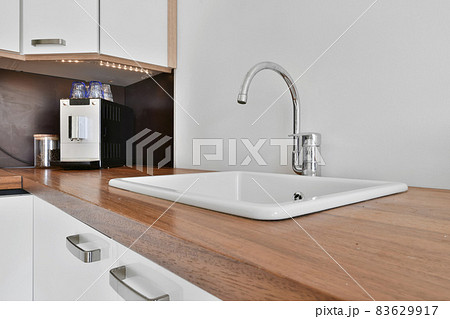 Close up of elegant sink in luxury kitchen Close up of elegant sink in luxury kitchen 83629917