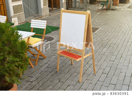 White blank signboard stand of street cafe White blank signboard stand of street cafe 83630391