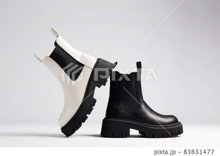 black and white boots. fashion shoes still life 83631477