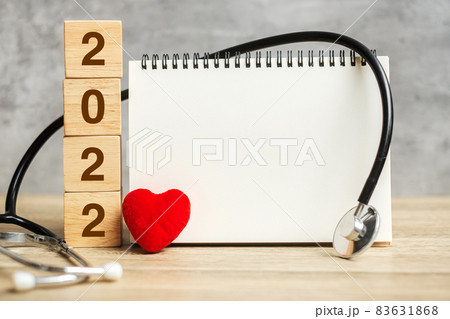 2022 Happy New Year for healthcare, Insurance, Wellness and medical concept. Stethoscope and blank notebook for copy space your text 2022 Happy New Year for healthcare, Insurance, Wellness and medical concept. Stethoscope and blank notebook for copy space your text 83631868
