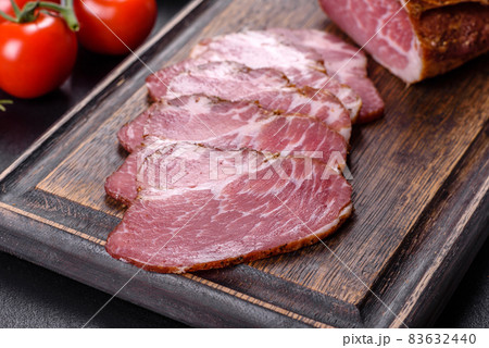 Delicious fresh bacon sliced with bread and vegetables Delicious fresh bacon sliced with bread and vegetables 83632440