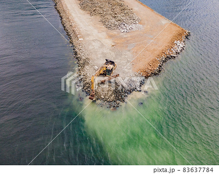 Heavy excavator working construction ground preparation beach on the sea shore, Construction vehicle Heavy excavator working construction ground preparation beach on the sea shore, Construction vehicle 83637784