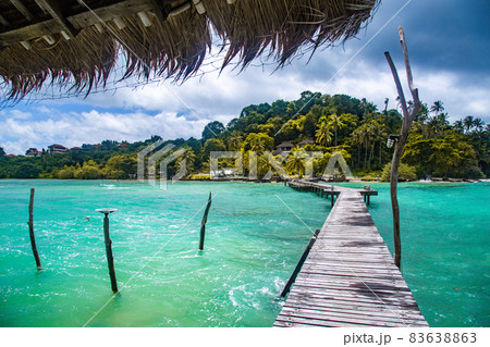 Wooden beach bar in sea and hut on pier in koh Mak island, Trat, Thailand Wooden beach bar in sea and hut on pier in koh Mak island, Trat, Thailand 83638863