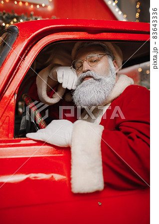 Santa Claus is preparing for Christmas. Portrait of Santa Claus driving Santa Claus is preparing for Christmas. Portrait of Santa Claus driving 83643336