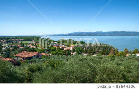 Castiglione del lago, Umbria, Italy. August 2020. Amazing landscape of the Trasimeno lakefront. From the top of the hill of the historic village the view is very wide. 83644306