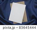 Flat lay composition with blank white paper on brown envelope. 83645444