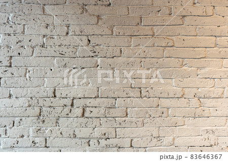 Texture of old white brick wall large with decorations and copy space Background Texture of old white brick wall large with decorations and copy space Background 83646367