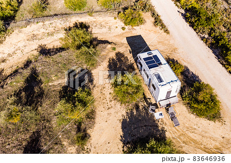 Caravans with solar panels on roof camping on nature. 83646936