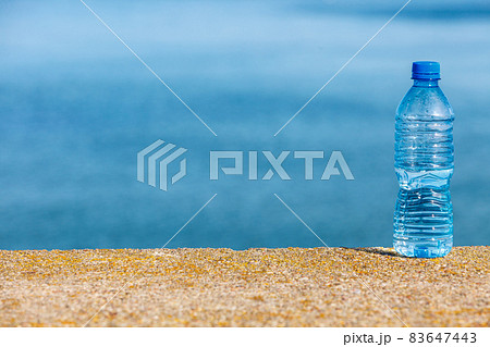 Water plastic bottle outdoor on sea shore Water plastic bottle outdoor on sea shore 83647443