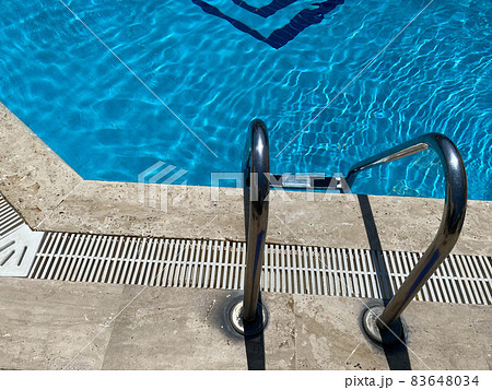 Close-up of handrails for entering the swimming pool 83648034