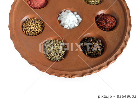 Different spices and herbs in clay pit tray for cooking Thai food on background. 83649602