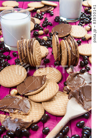 breakfast with chocolate cookies and a glass of milk breakfast with chocolate cookies and a glass of milk 83650141