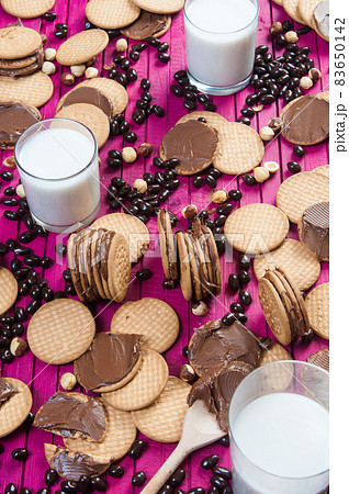 breakfast with chocolate cookies and a glass of milk 83650142