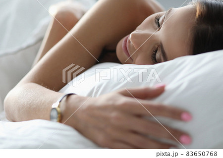Nude woman sleeps calmly at home under covers Nude woman sleeps calmly at home under covers 83650768