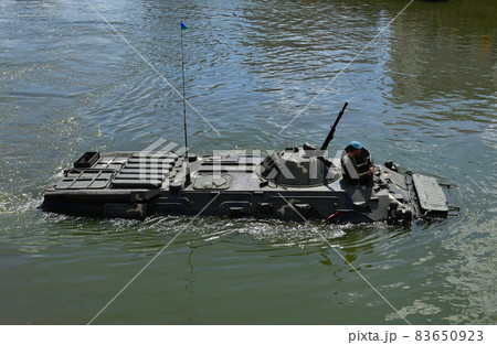 Sailing on BTR APC Amphibious Armoured Personnel Carrier. Armed forces on military exercises  83650923
