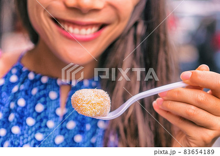 Mochi cake Asian woman in Japan eating japanese food dessert rice paste. Mochi cake Asian woman in Japan eating japanese food dessert rice paste. 83654189
