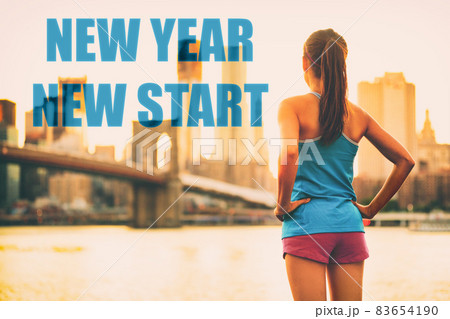 New Year resolution fitness athlete runner woman. New Year New Start healthy woman from behind looking away at city sunset in confidence. Brooklyn Bridge in NYC, New York City, USA. Getting in shape. New Year resolution fitness athlete runner woman. New Year New Start healthy woman from behind looking away at city sunset in confidence. Brooklyn Bridge in NYC, New York City, USA. Getting in shape. 83654190