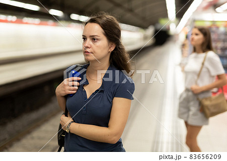 Woman waiting for subway train Woman waiting for subway train 83656209