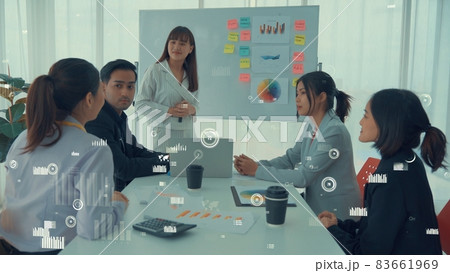 Business people in corporate staff meeting with envisional graphic Business people in corporate staff meeting with envisional graphic 83661969