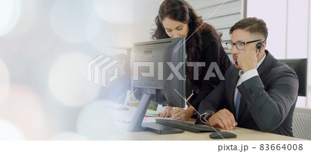 Business people wearing headset working in office broaden view 83664008