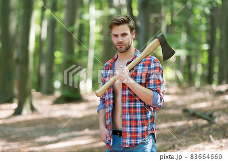 Unshaven handsome man in open plaid shirt with jeans Unshaven handsome man in open plaid shirt with jeans 83664660