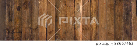 Old barn wood background texture. Vintage weathered rough planks wide wall backdrop. Old barn wood background texture. Vintage weathered rough planks wide wall backdrop. 83667462