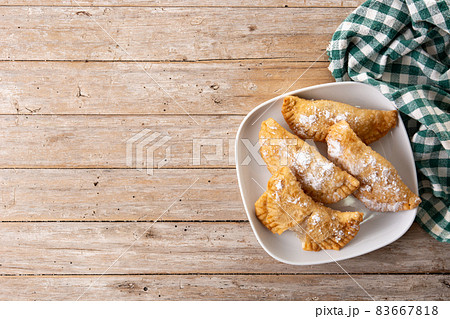 Spanish sweet stuffed pastry filled with angel hair 83667818